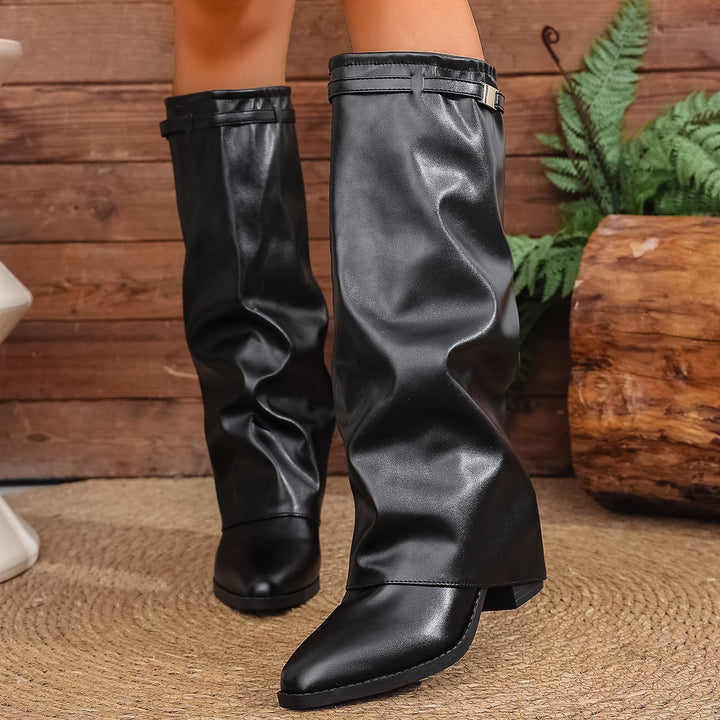 Women's knee-high slouch boots with pointed toe, low block heel, and decorative shaft strap Mune Fashion