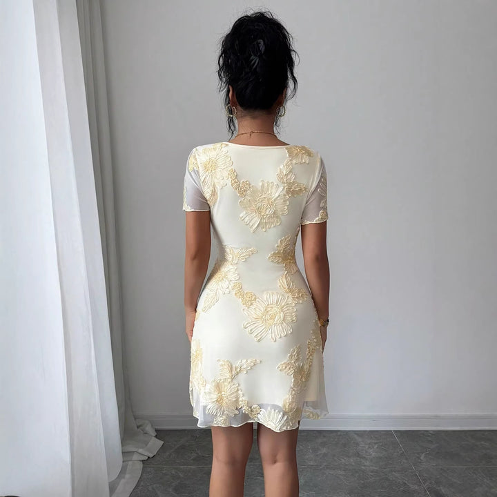 Women's figure-hugging tulle mini dress with three-dimensional flower embroidery, front slit, and short transparent sleeves Mune Fashion