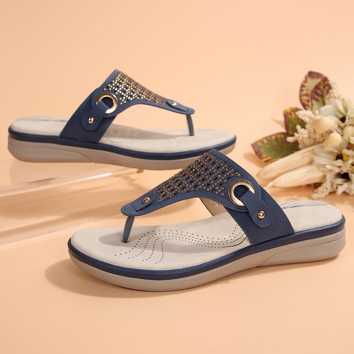 Women's toe-post sandals with viscoelastic comfort footbed, decorative eyelet application, and perforated insole Mune Fashion