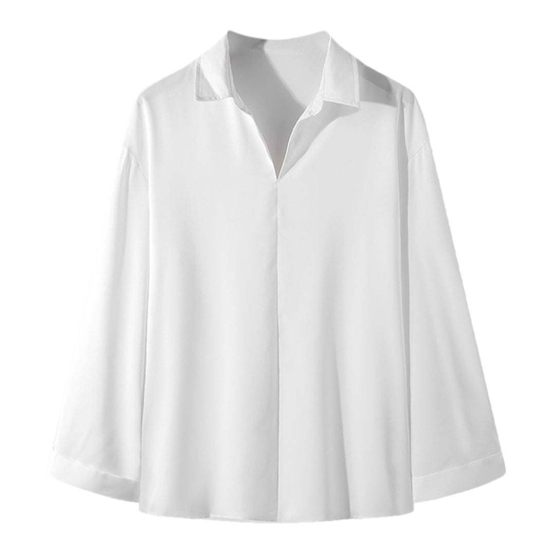 Women's loosely cut tunic blouse with deep V-neck, concealed button placket, and dropped shoulders Mune Fashion