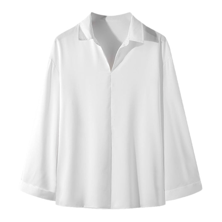 Women's loosely cut tunic blouse with deep V-neck, concealed button placket, and dropped shoulders Mune Fashion