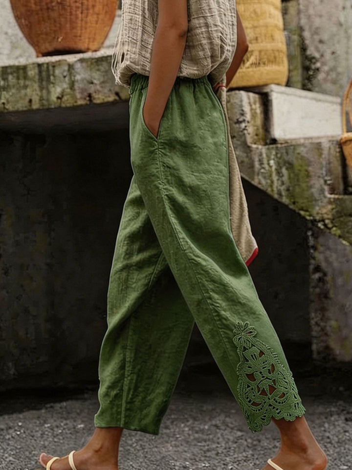 Women's casual pants made of linen blend with elastic drawstring waistband and lace embroidery on the leg