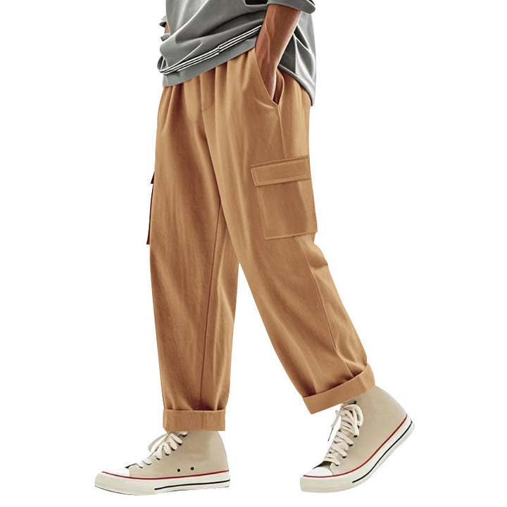 Men's wide cargo pants with flap pockets, elastic comfort waistband, and turned-up hem Mune Fashion