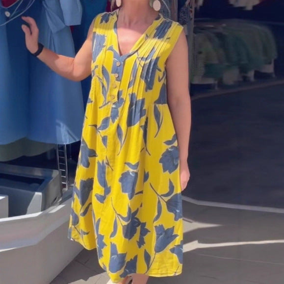 Women's sleeveless A-line midi dress with V-neck, bust pleats, button placket, and large floral print Mune Fashion