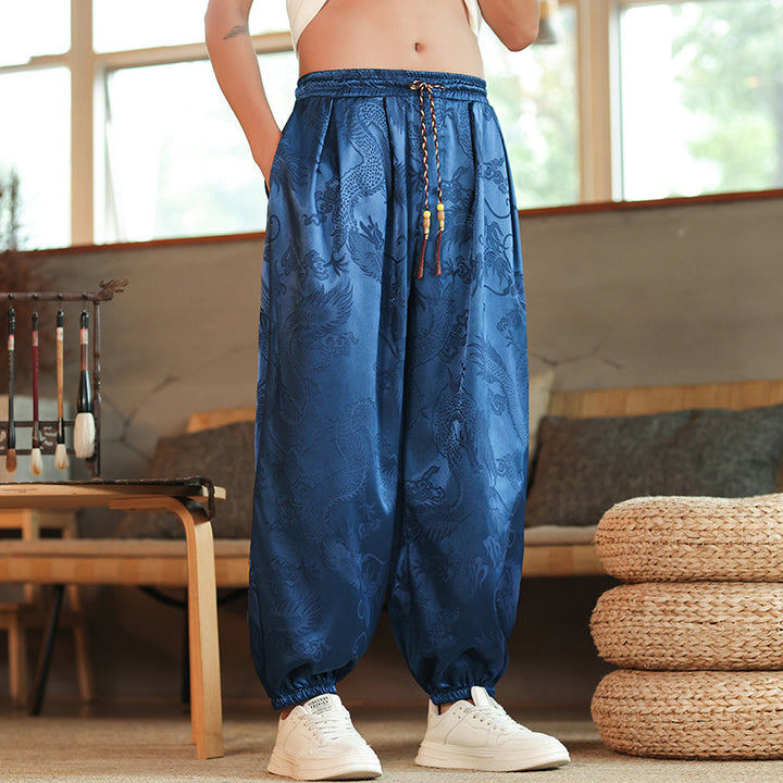 Men's wide Jacquard satin harem pants with drawstring, elastic cuffs, and traditional dragon motif Mune Fashion