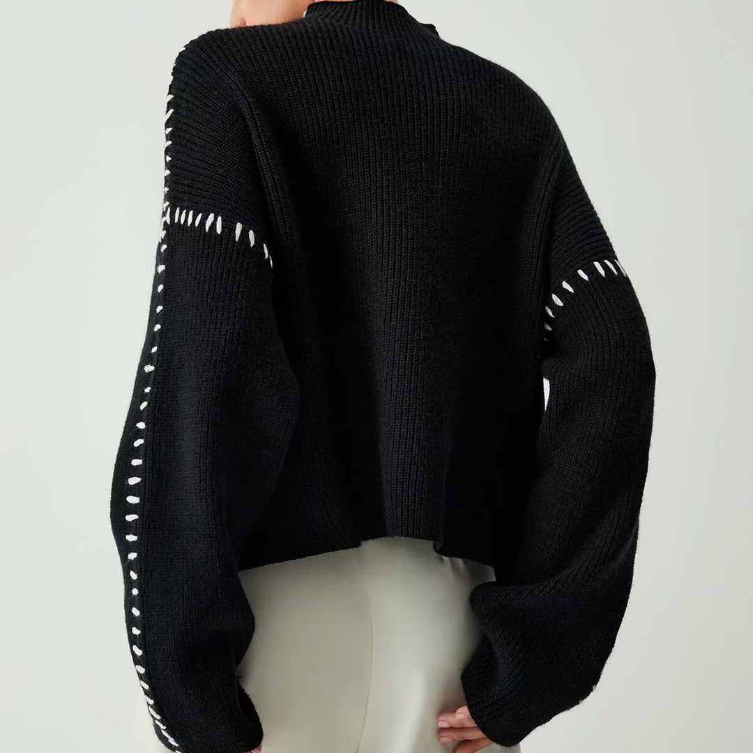 Women's chunky knit oversized sweater with high roll neck edge and decorative stitch sleeves Mune Fashion