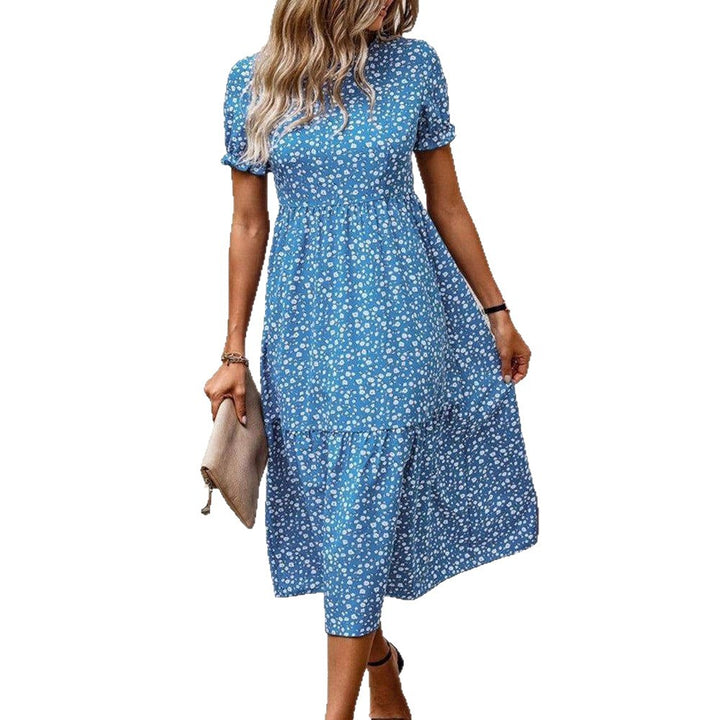 Women's knee-length A-line dress with high round neckline, puff sleeves, gathered empire waist, and tiered hem Mune Fashion