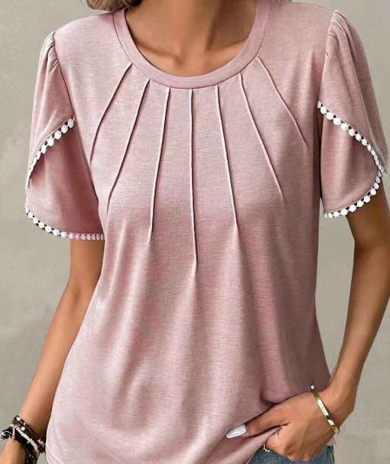 Women's round neck shirt with decorative pleated front, flutter sleeves and pompom trim Mune Fashion
