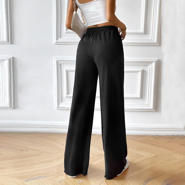 Women's wide lounge pants with elastic waistband, drawstring and side pockets Mune Fashion