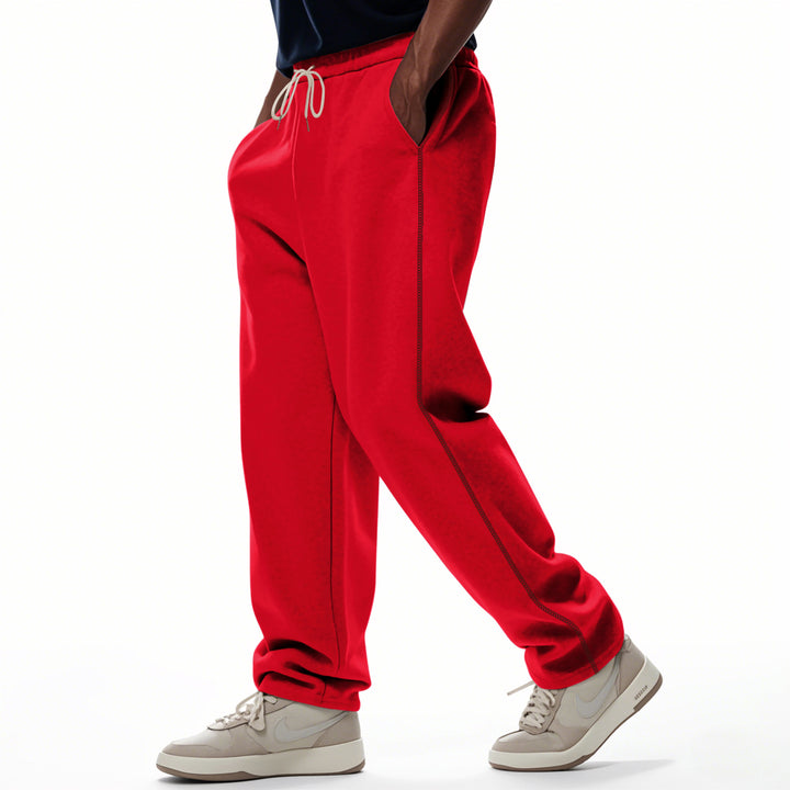 Men's casually fitting sweatpants with side decorative seam, elastic comfort waistband, and deep side pockets Mune Fashion