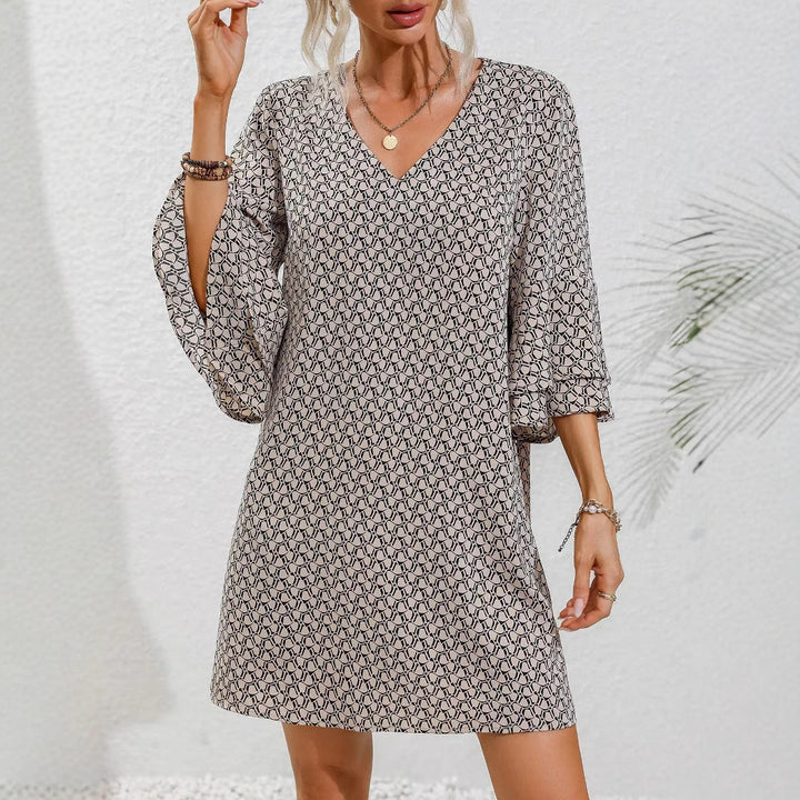 Women's flowing tunic mini dress with V-neck graphic chain pattern and double-layered bell sleeves Mune Fashion
