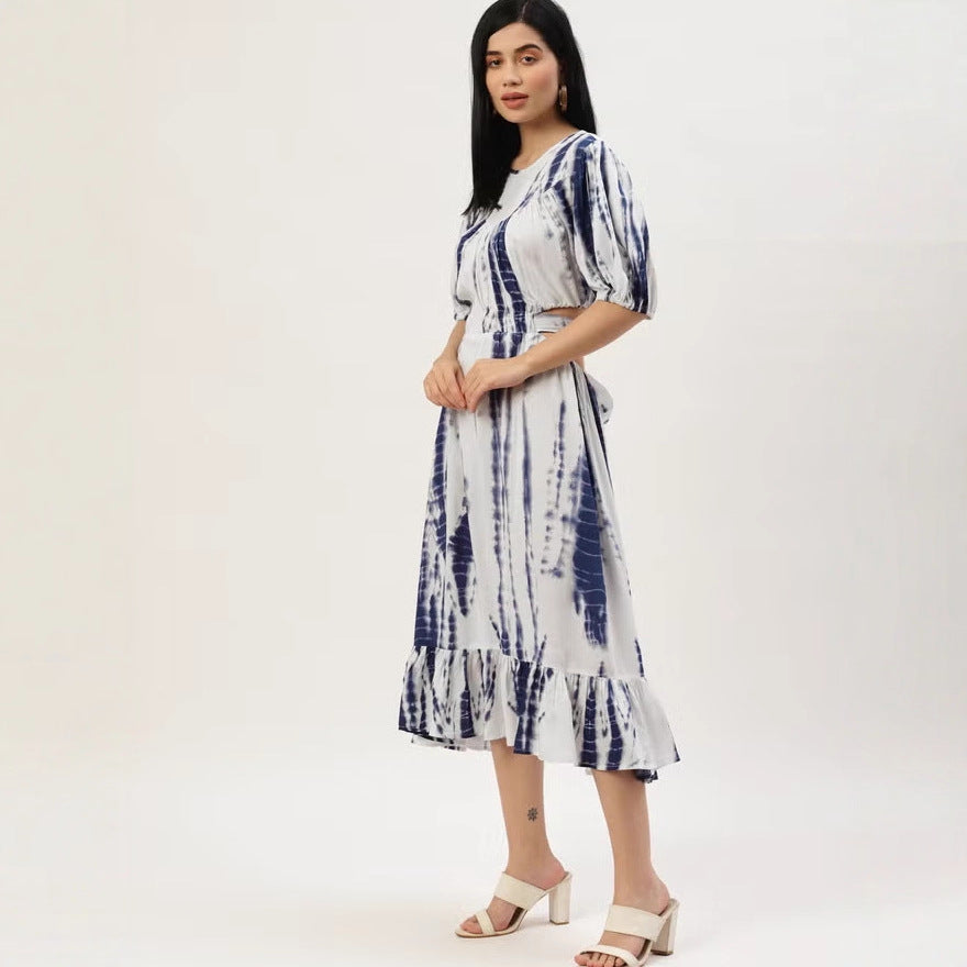 Women’s midi dress with tie-dye print, fitted cut, side cut-out, and ruffled hem.