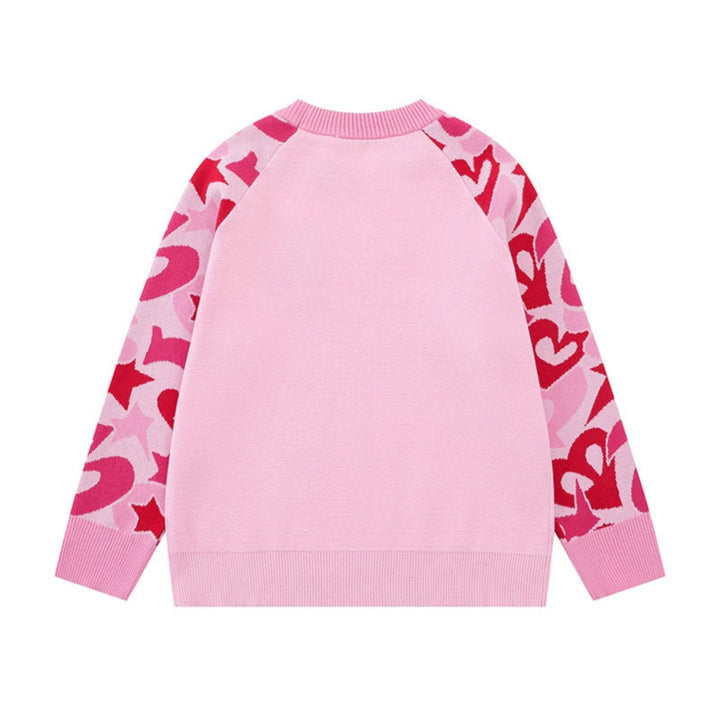 Women's knit sweater with raglan sleeves, statement jacquard sleeves, and ribbed hem Mune Fashion