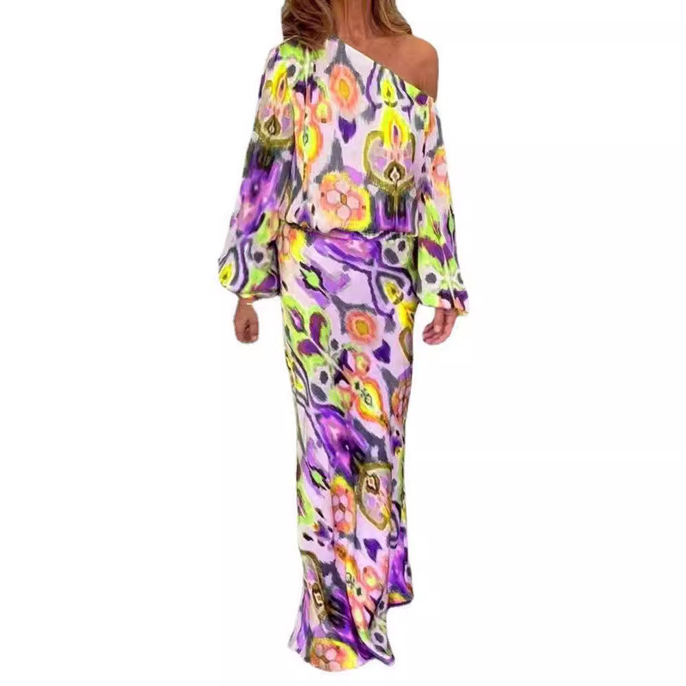 Women’s maxi dress with asymmetric one-shoulder, wide trumpet sleeves, and flowing satin print.