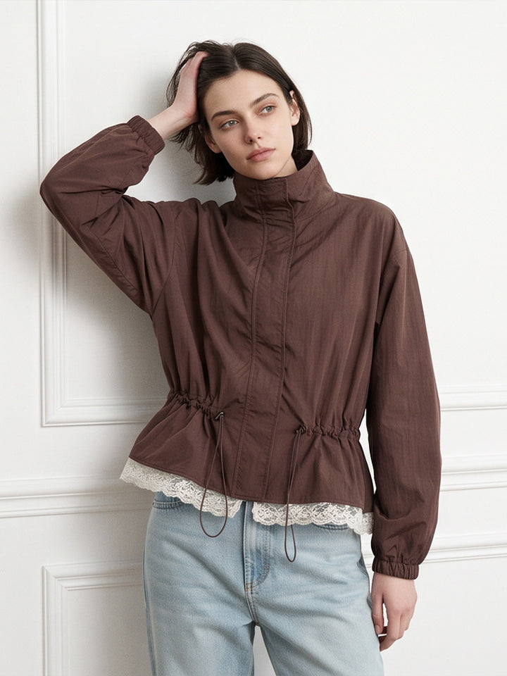 Women's oversized windbreaker with high stand-up collar, drawstring waist, and elastic cuffs