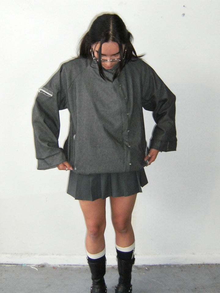 Women’s oversized boxy jacket with asymmetric button closure and arm pocket Mune Fashion