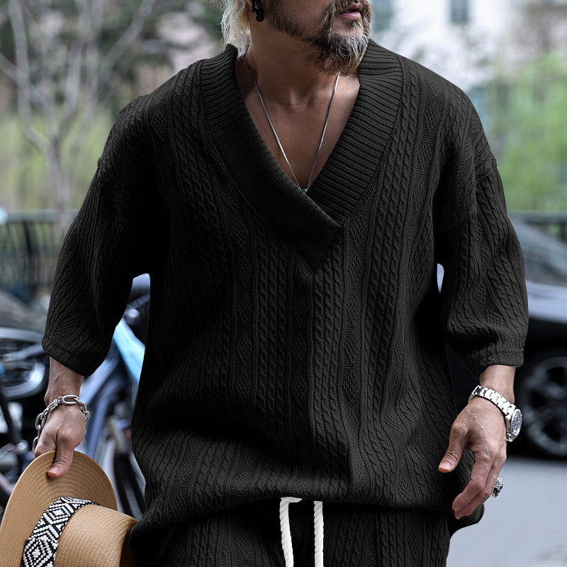 Women's short-sleeve knitted sweater in a loose fit with deep V-neck and cable pattern Mune Fashion