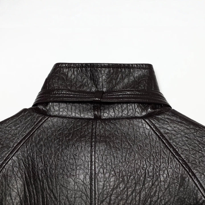 Women's short jacket made of faux leather with high buckle collar and waist belt Mune Fashion