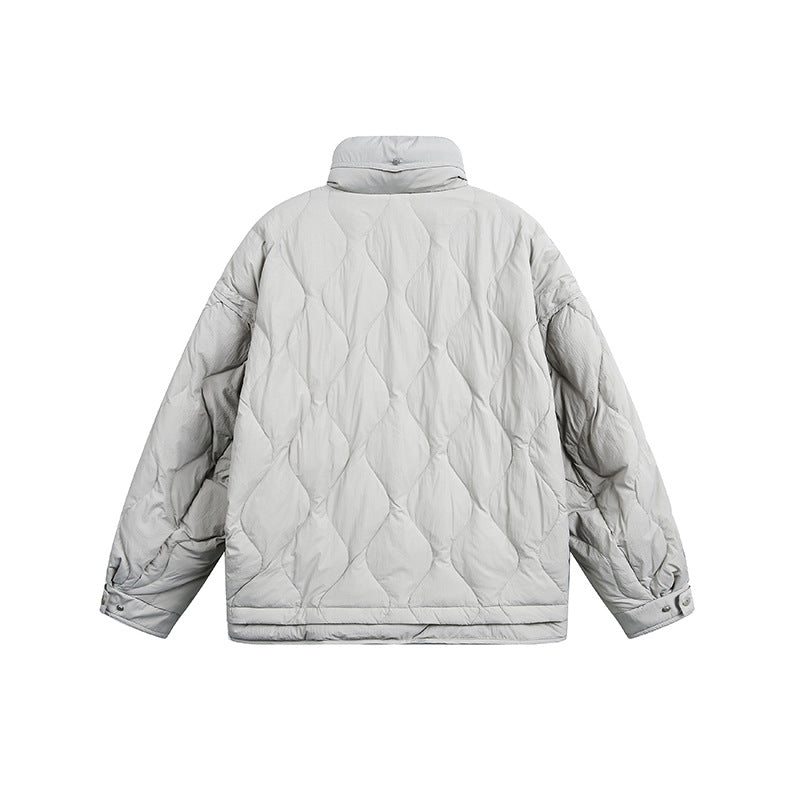 Women's oversized quilted jacket with stand-up collar, wave quilting, and drawstring hood