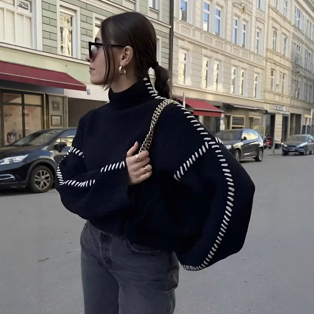 Women's chunky knit oversized sweater with high roll neck edge and decorative stitch sleeves Mune Fashion