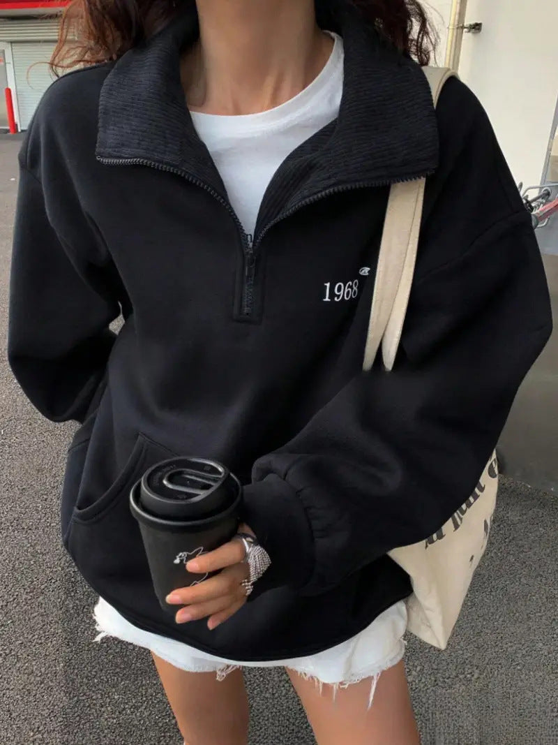 Women's oversized half-zip sweatshirt with high collar, kangaroo pocket, and casual oversized fit Mune Fashion