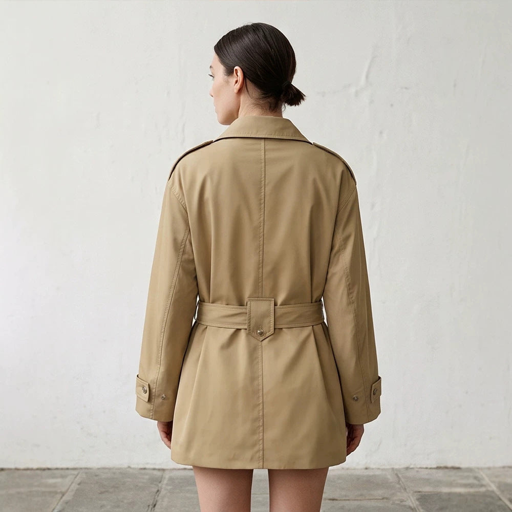 Women's short trench coat with waist belt, shoulder flaps, and adjustable cuffs Mune Fashion