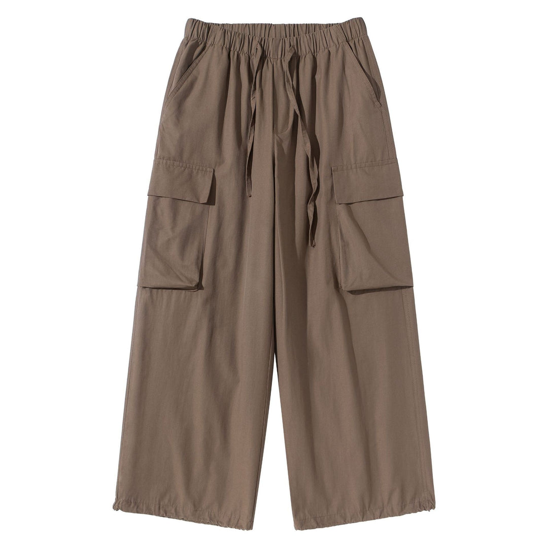 Women's culotte cargo bermudas in utility look with elastic tunnel drawstring waistband and large flap pockets.