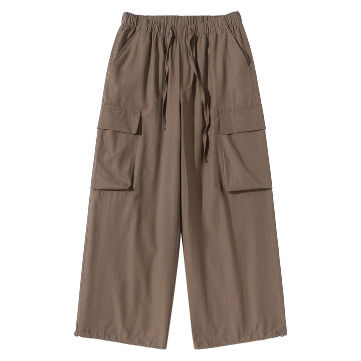 Women's culotte cargo bermudas in utility look with elastic tunnel drawstring waistband and large flap pockets.