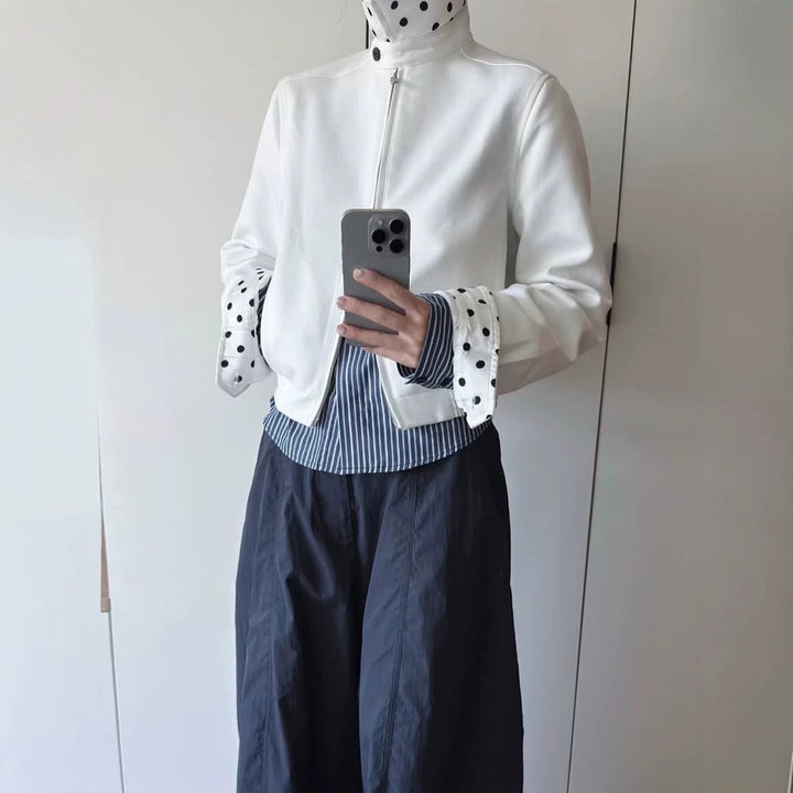 Women’s short-cut blouson jacket with stand-up collar, concealed zipper and contrasting polka dot patterned lining Mune Fashion
