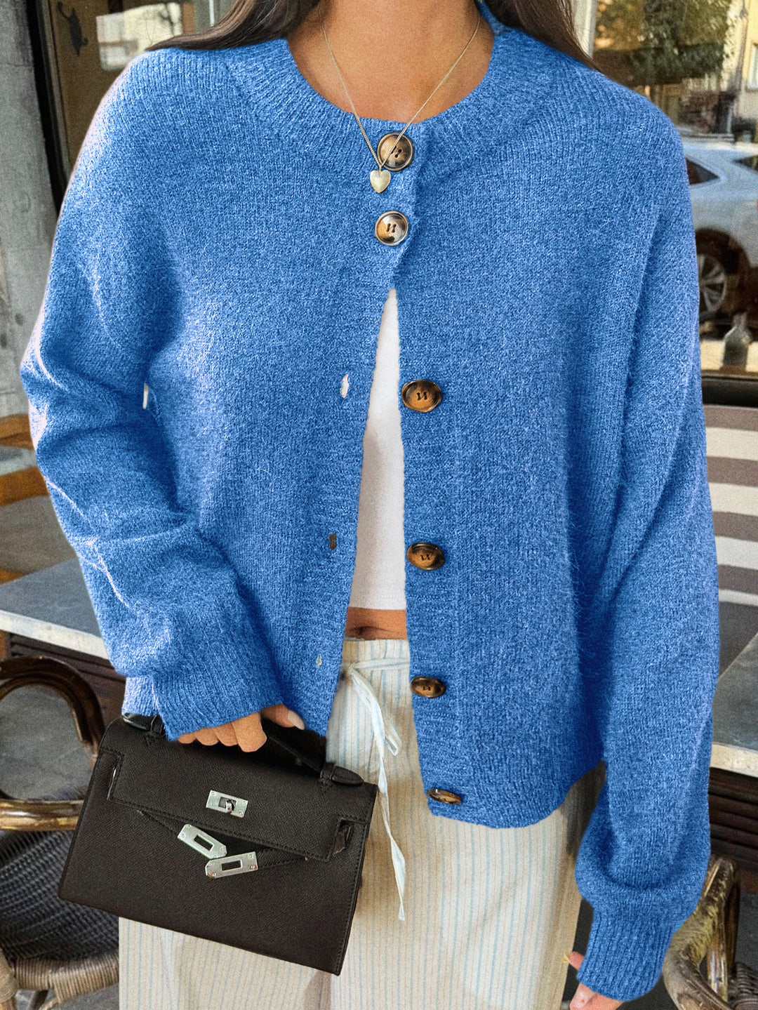 Women's cozy oversized knitted cardigan with horn button placket and round neckline Mune Fashion