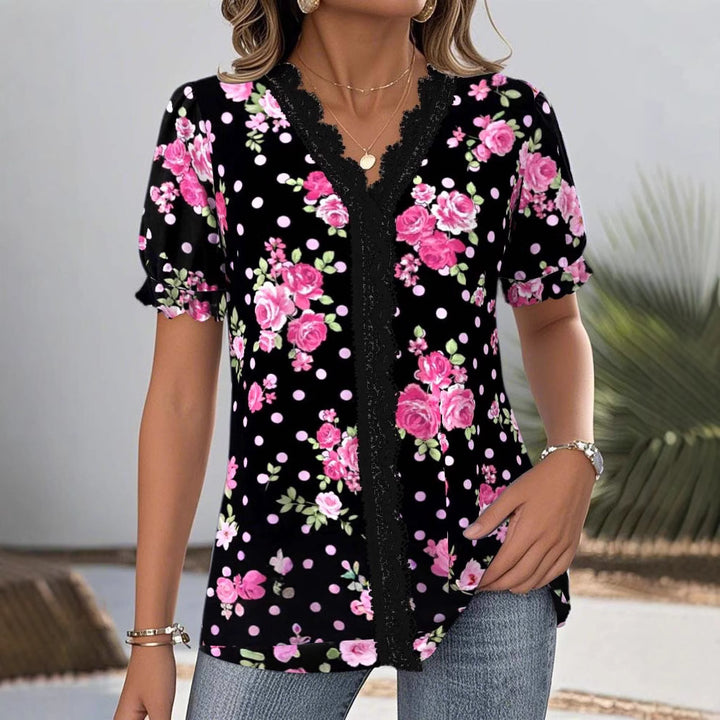 Ladies floral V-neck blouse with decorative lace trim and gathered short sleeves Mune Fashion