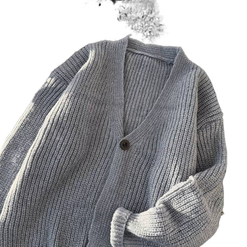 Unisex chunky knit cardigan in oversized cut with deep V-neck and distinctive button placket Mune Fashion