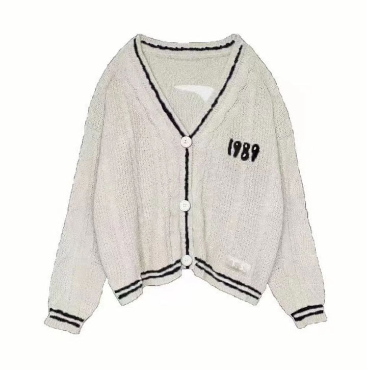 Women’s cropped cardigan with V-neck, contrast piping and oversized sleeves Mune Fashion