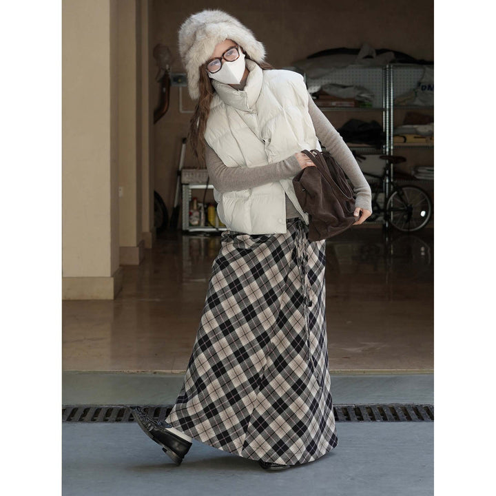 Women's lightweight quilted vest with high collar and snap button placket Mune Fashion