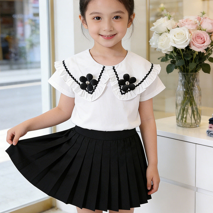 Girl's blouse with ruffled hem and floral design Mune Fashion