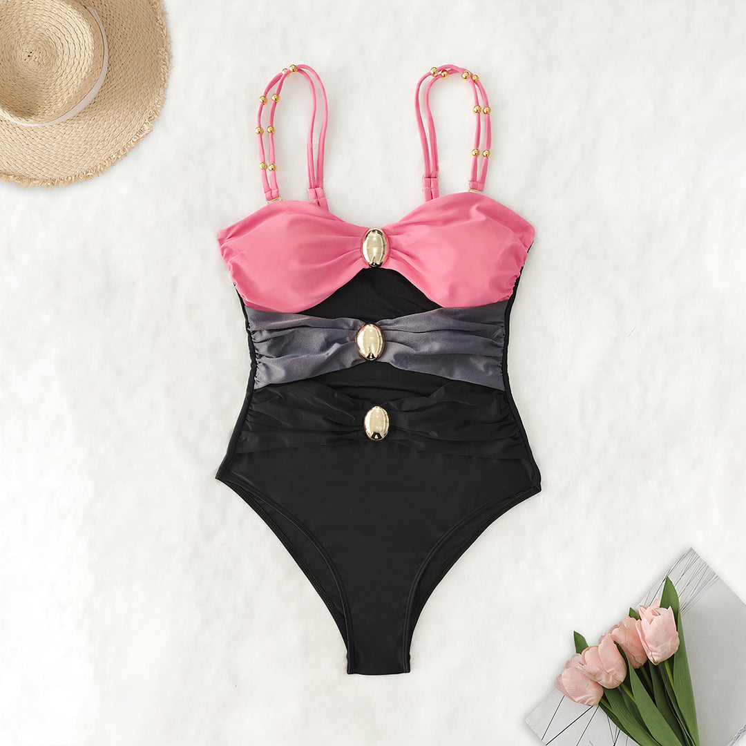 Women's one-piece swimsuit with intricate cut-outs and decorative metal accents Mune Fashion