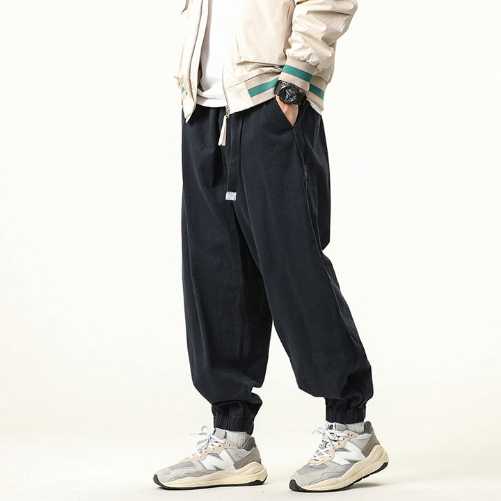 Men's wide relaxed cargo pants in jogger style with elastic tunnel drawstring waistband and cord decoration Drune