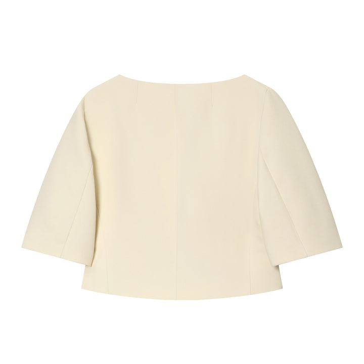 Women's tailored boxy short jacket with round neck, three-quarter sleeves and decorative button placket Mune Fashion