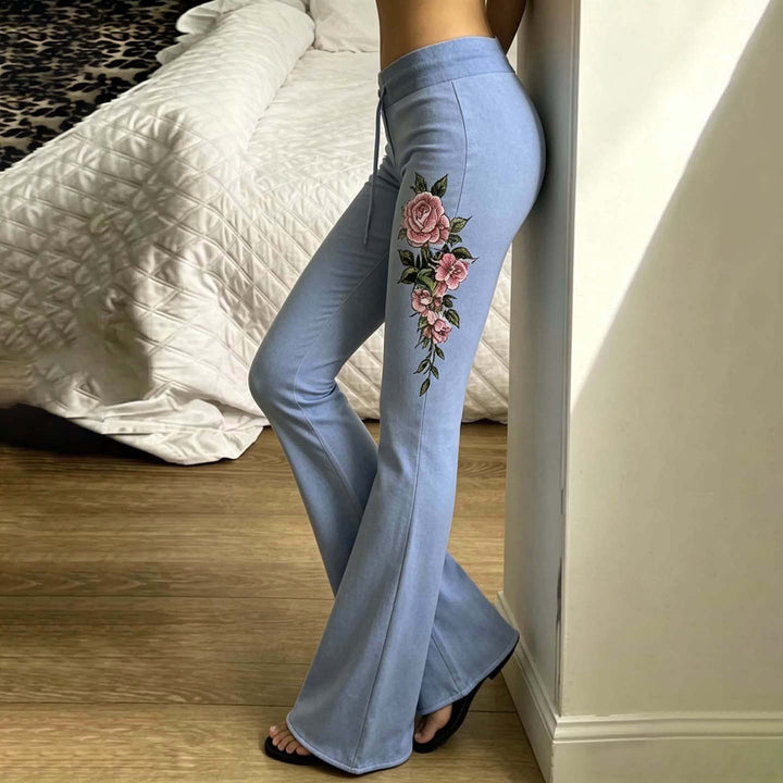 Women's casual jersey sweatpants with drawstring, floral side print, and statement lettering Mune Fashion
