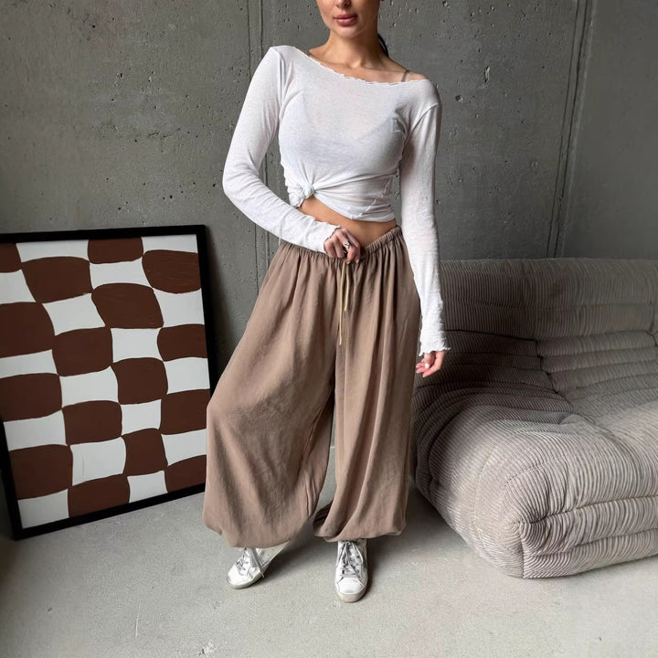 Women's wide harem balloon pants with high elastic waistband, drawstring, and casual wide fit.