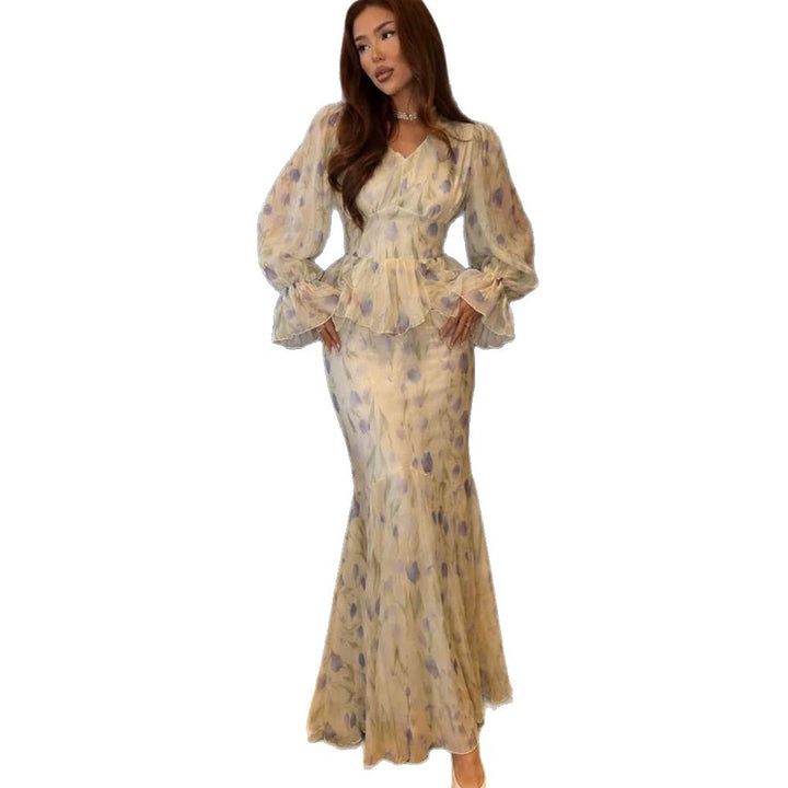 Women's dress made of transparent chiffon with fitted bodice, ruffled peplum and voluminous bell sleeves Mune Fashion