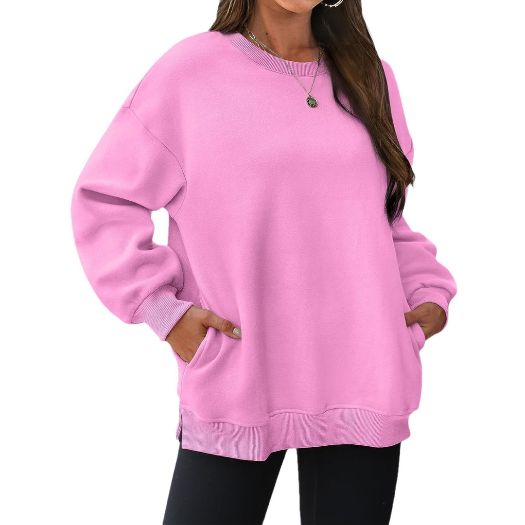 Women's extended oversized round neck sweater with side pockets, ribbed cuffs, and dropped shoulder Mune Fashion