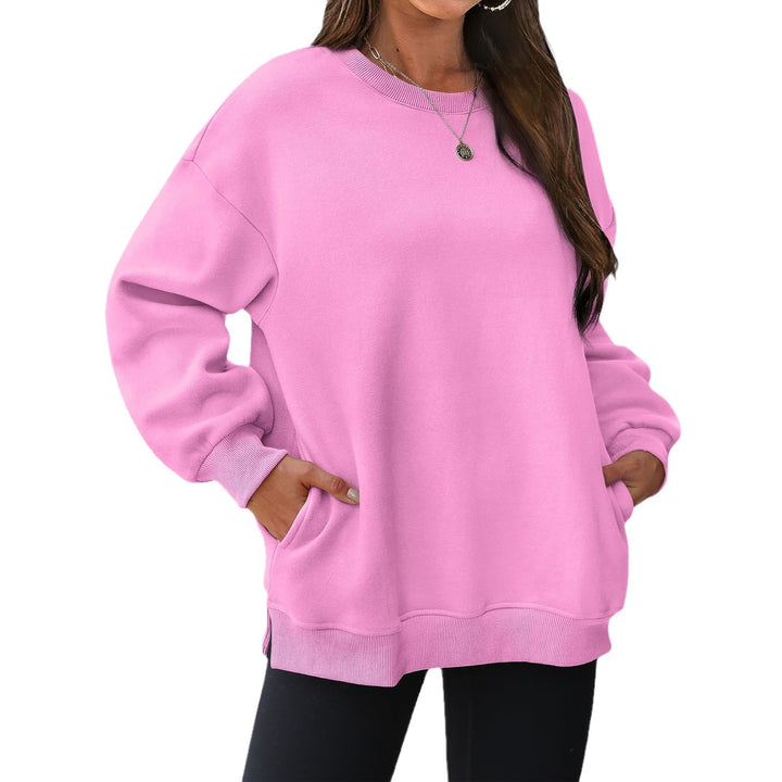 Women's extended oversized round neck sweater with side pockets, ribbed cuffs, and dropped shoulder Mune Fashion