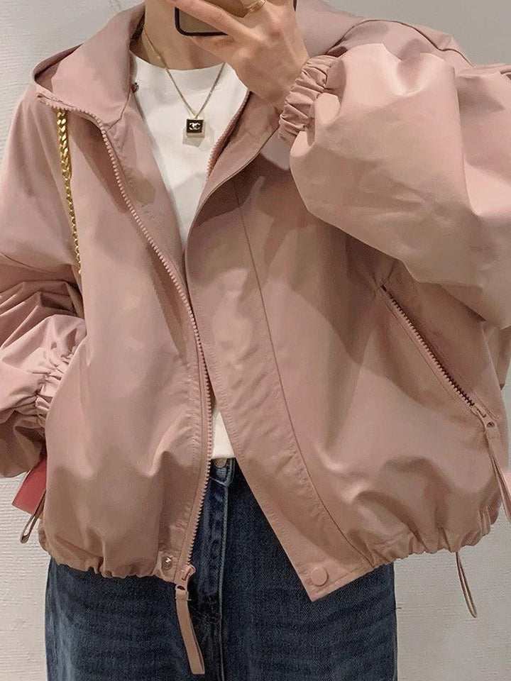 Women's oversized bomber-style hooded jacket with drawstring, elastic cuffs, and side zip pockets Mune Fashion
