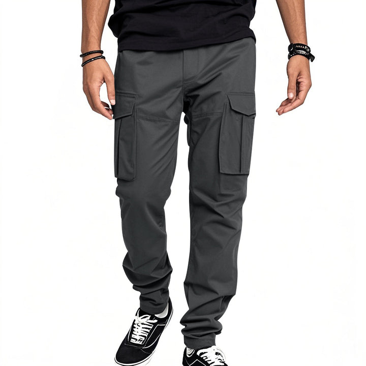 Men's nan utility cargo pants with large patch flap pockets and a tapered silhouette Mune Fashion