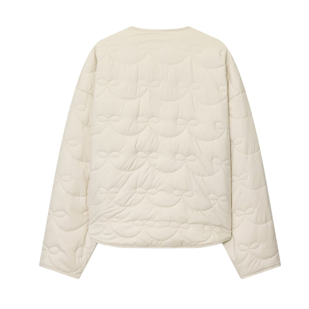 Women’s quilted jacket without collar with decorative bow quilting and snap button closure Mune Fashion