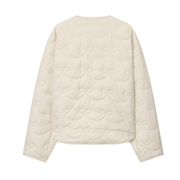 Women’s quilted jacket without collar with decorative bow quilting and snap button closure Mune Fashion