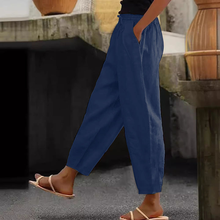 Women's loose-fitting linen blend pants with elastic waistband, drawstring, and angled side pockets Mune Fashion
