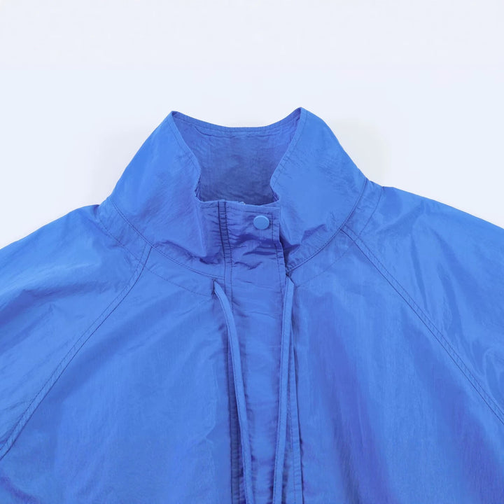 Women Lightweight Windbreaker Jacket with High Stand Collar, Drawstring Hem and Raglan Sleeves Mune Fashion