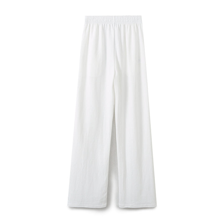 Women's wide comfort lounge pants with elastic comfort waistband, central slit and flowing palazzo silhouette Mune Fashion